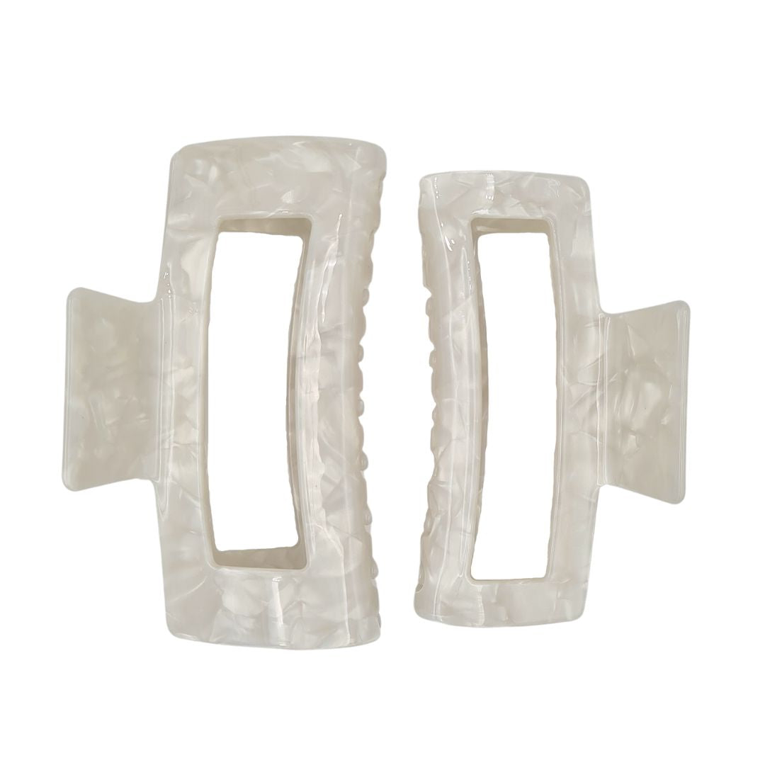 large claw clip in pearl white extra large claw clip size is on the left and large claw clip is on the right
