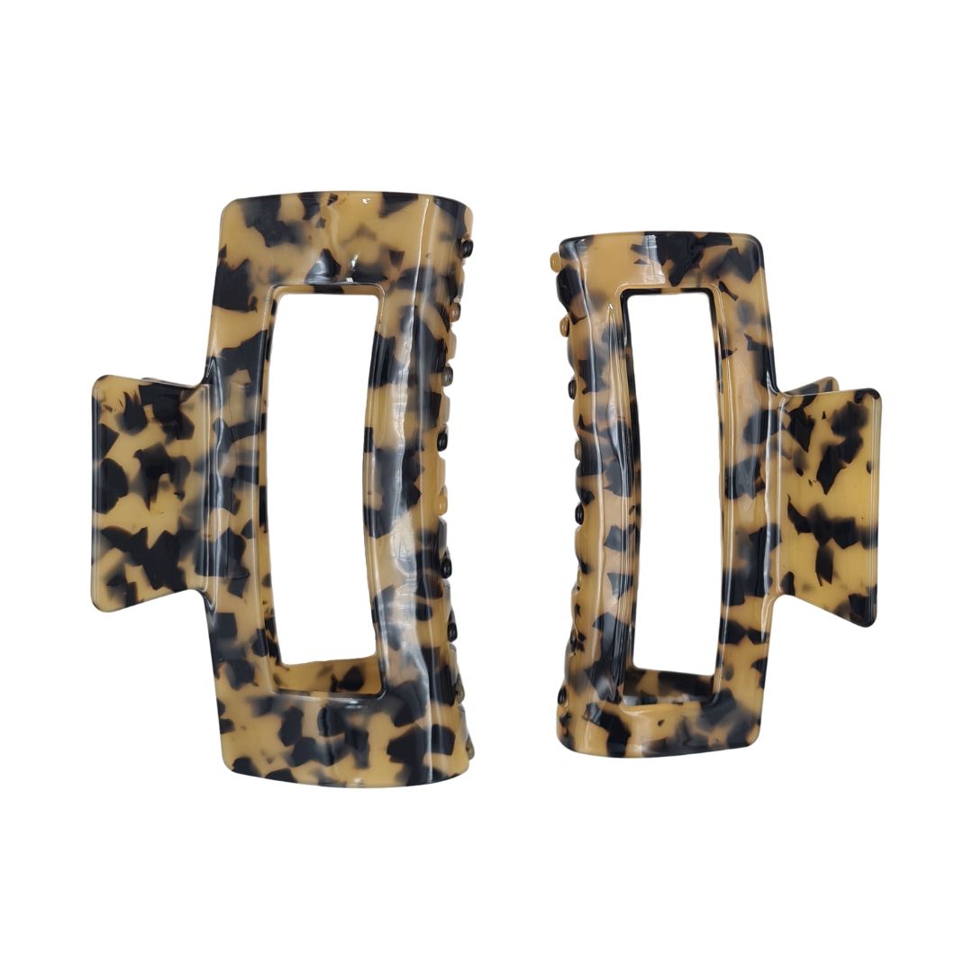 large claw clip in tortoise extra large claw clip size is on the left and large claw clip is on the right
