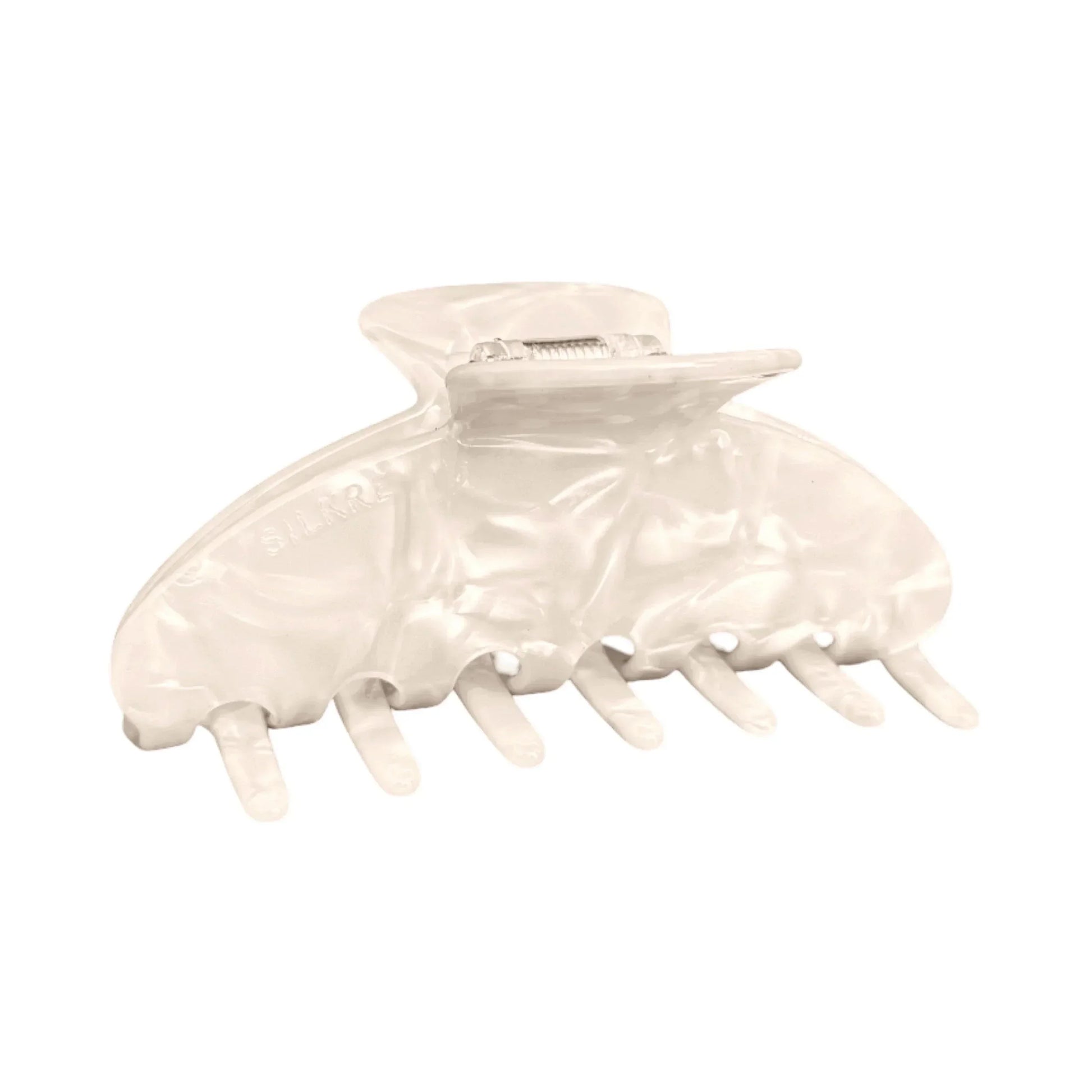 large claw clip designed for thin hair in a cream white marble colour 